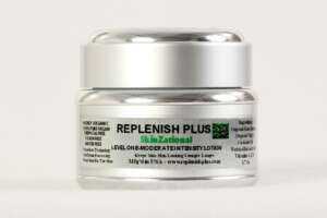 Replenish Plus Skinzational skin cream in silver packaging